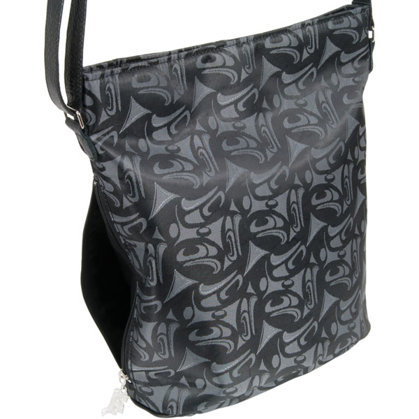 3 Eagles Urban Bag : A second exterior zipped pocket (7 x 7 inches) on the side of the bag can securely hold your cell phone or other small items, with a metal zipper tab in Corrine’s raven stealing the sun design.