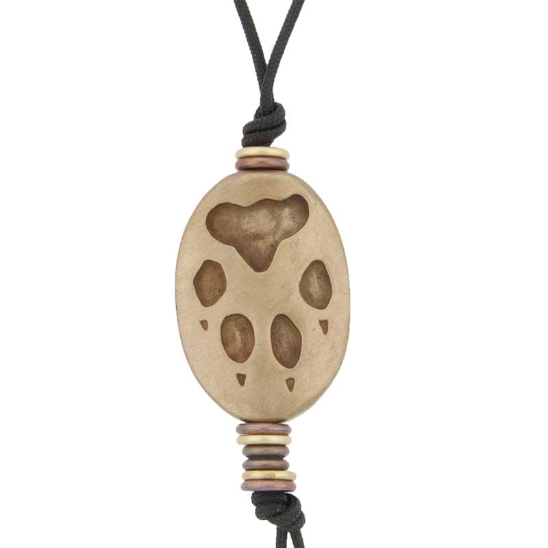 Wolf Amulet : The reverse side features the wolf's pawprints.